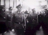 Heydrich followed by Hacha inspects train.